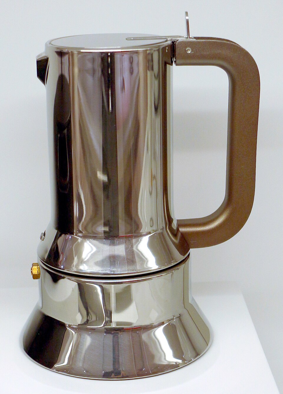 Richard Sapper’s stainless-steel Alessi 9090 coffee maker with its lever handle.